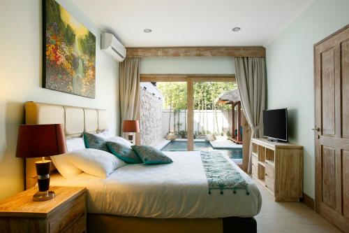 Ένα ή περισσότερα κρεβάτια σε δωμάτιο στο Villa Adon