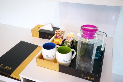 a box with cups and a bottle on a counter at five6 Hotel Splendour in Singapore