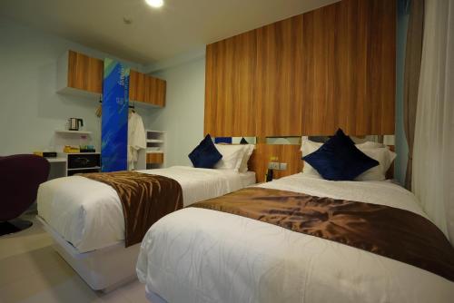 Säng eller sängar i ett rum på five6 Hotel Splendour