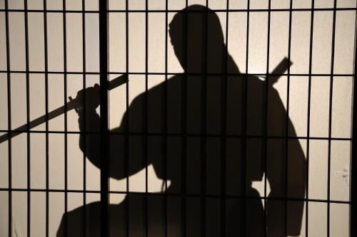 a shadow of a person behind a fence at Hill Hotel Sunpia Iga in Iga