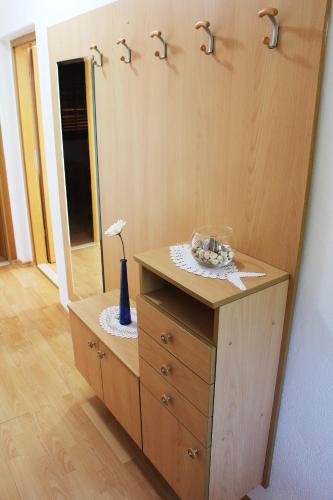 a dresser with a mirror on top of it at Apartment Teraferma in Komiža