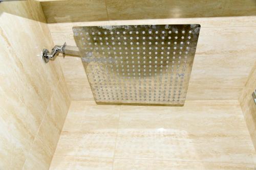a shower in a bathroom with a shower curtain at B&B Quintino Sella in Iglesias