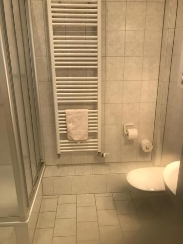 a bathroom with a shower with a sink and a towel at Keglerbörse "Haus Ida" in Kleve