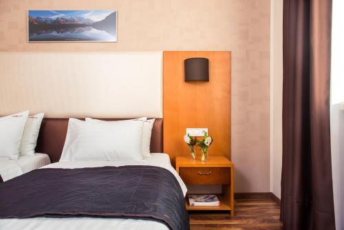 Postel nebo postele na pokoji v ubytování Greguar Hotel by UHM