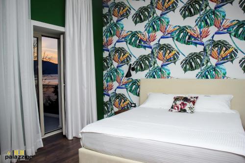 Ένα ή περισσότερα κρεβάτια σε δωμάτιο στο Le Palazzine Hotel