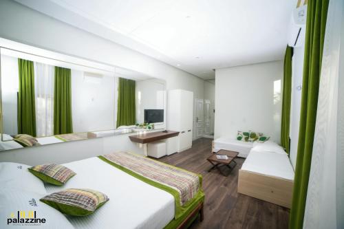 Ένα ή περισσότερα κρεβάτια σε δωμάτιο στο Le Palazzine Hotel