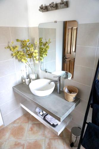 a bathroom with a sink and a mirror at Lone Star House in Sainte-Maxime