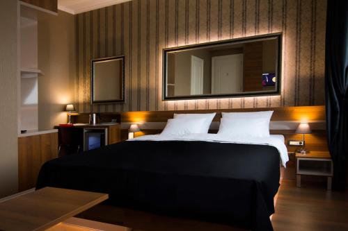 Postel nebo postele na pokoji v ubytování B&B Wimbledon Garni Concept