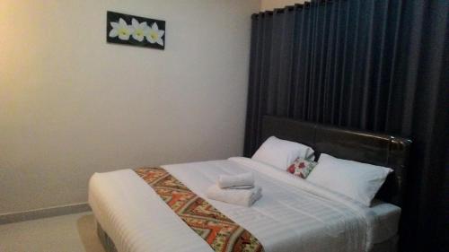 Cama ou camas em um quarto em Griya Bun Sari