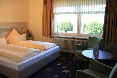 Ein Bett oder Betten in einem Zimmer der Unterkunft Hotel Seeterrassen
