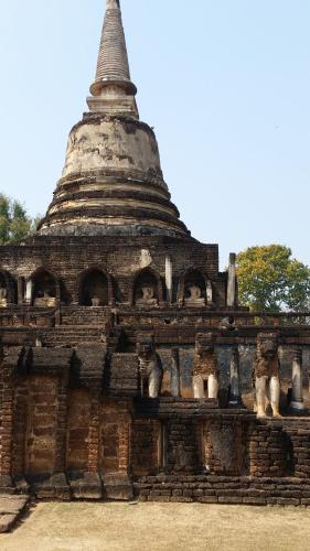 a stone building with a large tower on top at Vitoonguesthouse2fanrooms & Aircondition in Sukhothai