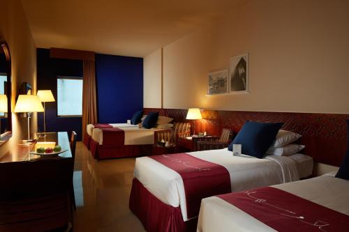 Tempat tidur dalam kamar di Makarem Umm Al Qura Hotel