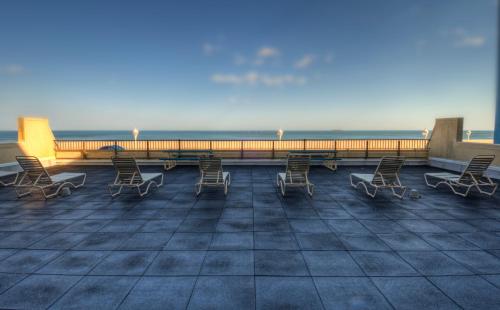 a group of chairs sitting on top of a roof at Boardwalk One in Ocean City