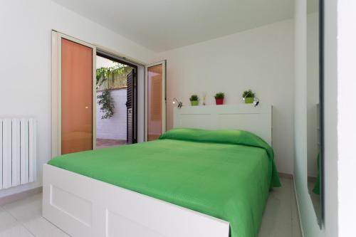Ένα ή περισσότερα κρεβάτια σε δωμάτιο στο Piccola Oasi