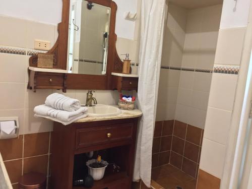 a bathroom with a sink and a mirror at Best place in Plaza Mayor Lima, Pizarro building in Lima