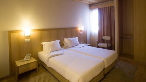 Posteľ alebo postele v izbe v ubytovaní Hotel Santo Andre