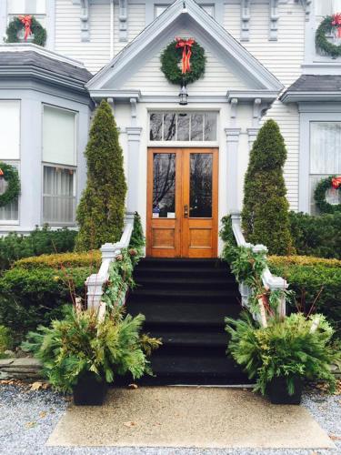 a house with a christmas wreath on the door at Shadow Lawn Inn in Rothesay