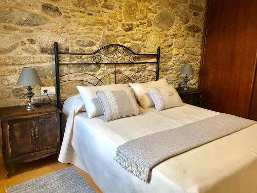 Ένα ή περισσότερα κρεβάτια σε δωμάτιο στο A Casa de Lelo