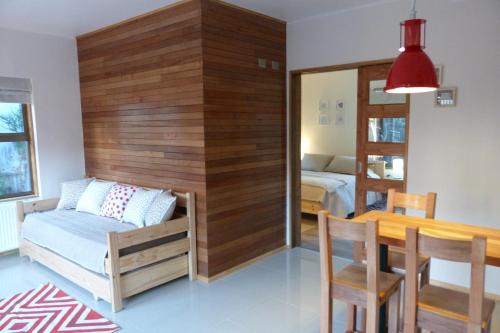 a room with a table and a bed and a dining room at Edificio Guadalauquen in Valdivia