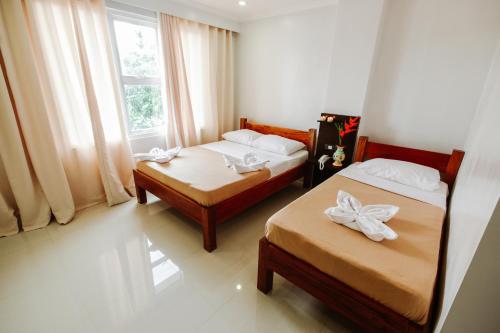 Katil atau katil-katil dalam bilik di Hotel Lapira