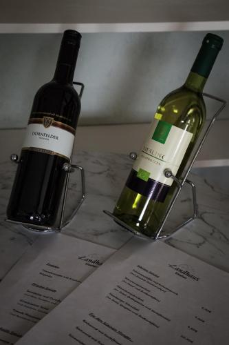 two bottles of wine sitting on top of a table at Landhaus Elbeflair bei Dömitz in Lenzerwische