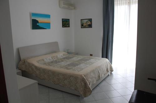 Katil atau katil-katil dalam bilik di Residence Azzurro Calaghena
