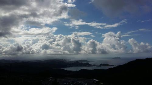a cloudy sky with a view of a body of water at Arabian Nights in Jiufen in Jiufen
