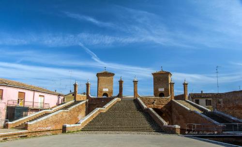 a set of stairs leading up to a building at Da Mattia in Comacchio