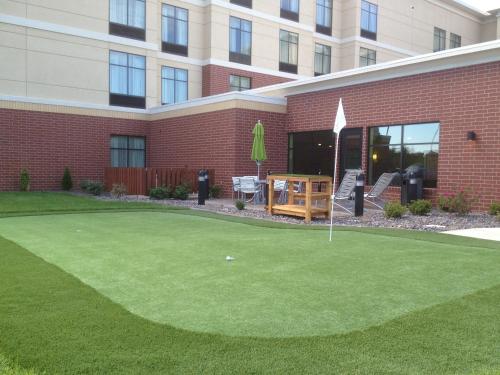 a putting green in front of a building at Homewood Suites by Hilton Joplin in Joplin