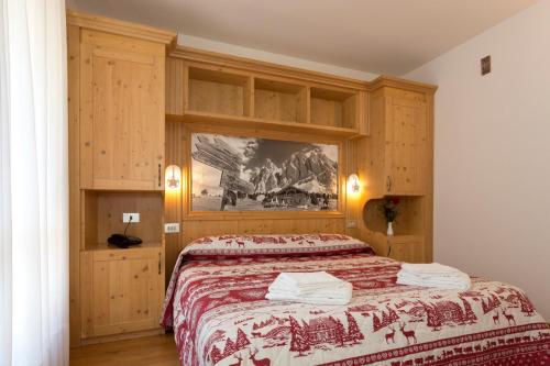 Postel nebo postele na pokoji v ubytování Hotel Cima Tosa
