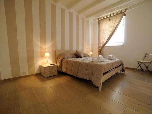 En eller flere senge i et værelse på Le Quattro Perle