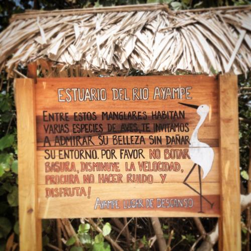 a sign for a zoo with a list of animals at Hostal Los Orishas in Ayampe