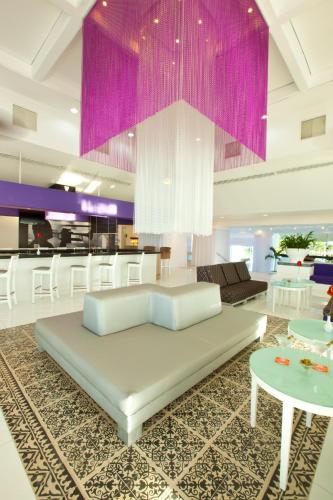a living room with a couch and a table at Krystal Cancun in Cancún