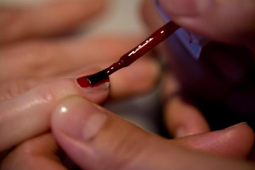 a person is brushing their teeth with a toothbrush at Vic's Land Holidays in Grimaud