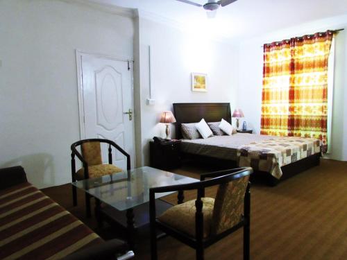 Postel nebo postele na pokoji v ubytování Stargaze Hotel & Apartment