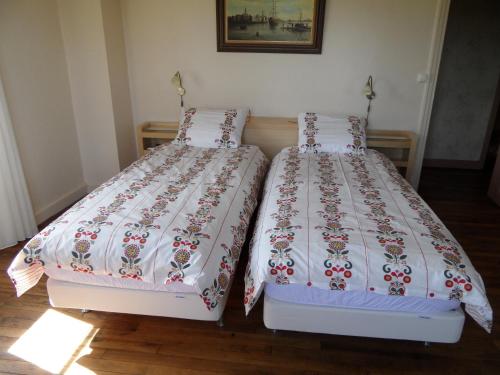 Säng eller sängar i ett rum på Domaine du Sable