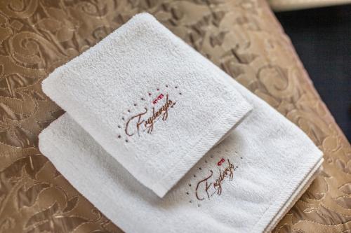 a white napkin sitting on top of a table at Hotel Fryderyk in Rzeszów