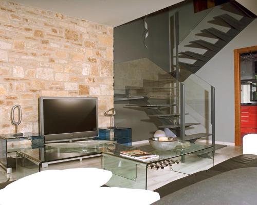 A television and/or entertainment centre at Alojamiento la Luz de la Sierra