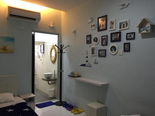 a room with a bathroom with a shower and a toilet at Fantasy Hotel in Malacca