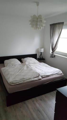 Postel nebo postele na pokoji v ubytování Ferienwohnung am Modenbach