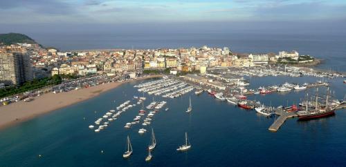 an aerial view of a harbor with boats in the water at Hotel & Restaurant Marina Palamós in Palamós