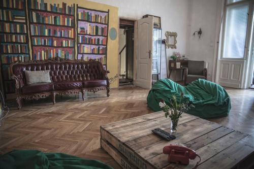 a living room with a couch and a coffee table at Baroque Hostel & Coworking in Budapest