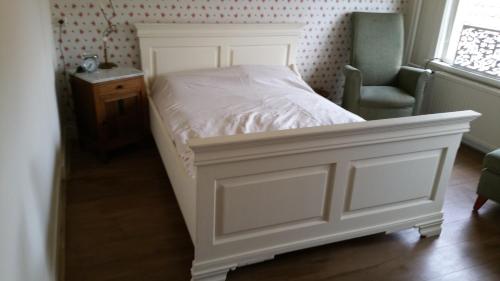 Postel nebo postele na pokoji v ubytování Gasterij d'Ouwe Pastorie