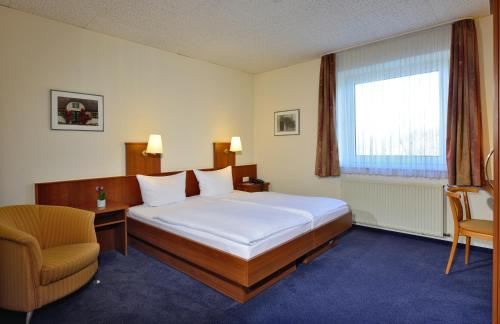 Hotel Haus Kronenthalにあるベッド