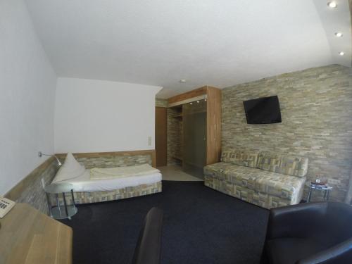 Postel nebo postele na pokoji v ubytování Hotel Wasserfall