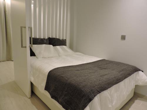 Postel nebo postele na pokoji v ubytování Sao Rafael - Apartamento Studio