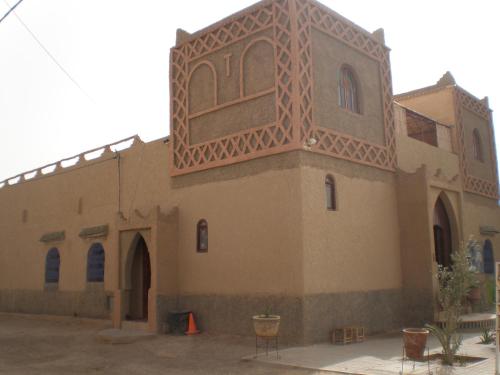 a building with an arabic design on it at Riad Aicha & Camel Trekking in Merzouga