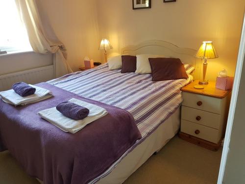 A bed or beds in a room at The Brambles B&B