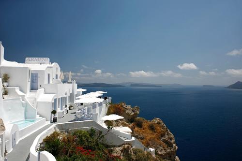 a view of the ocean and white buildings at Armeni Village in Oia