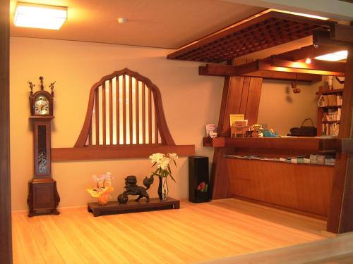 a room with a large harpsichord in the corner at Asanokan in Ise